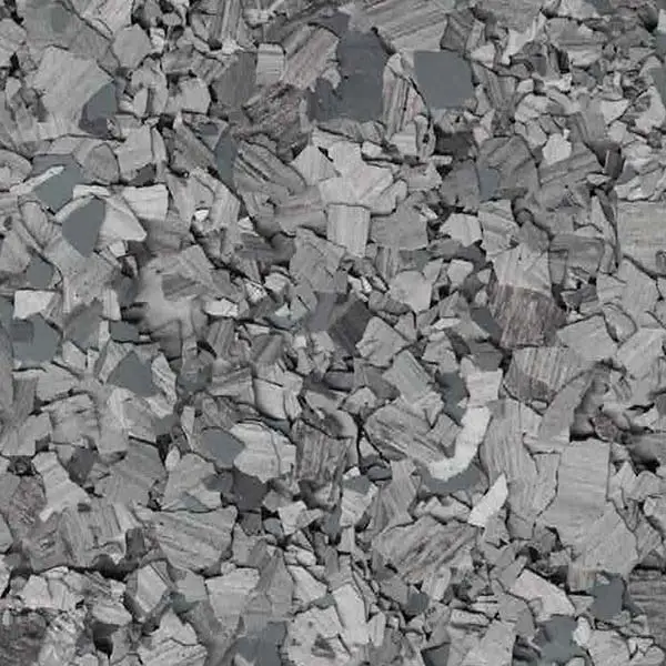 Close-up of a stone or rock surface, showcasing a textured, layered pattern in varying shades of gray. No landmarks or people present.