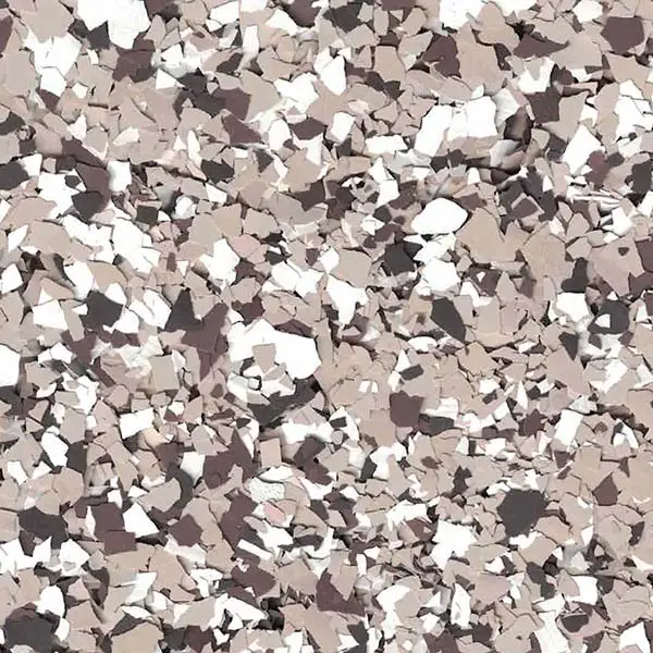 The image shows a close-up of a beige, brown, and white textured surface with irregularly shaped pieces scattered throughout.