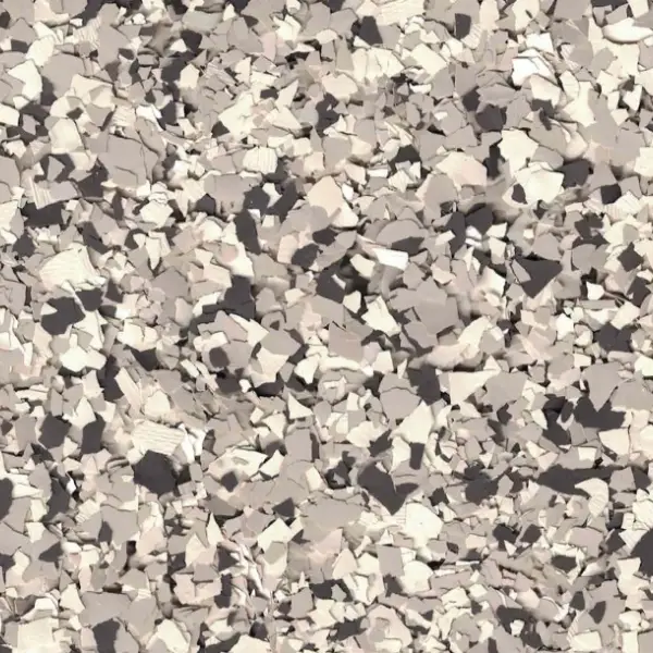 A close-up view of a ground surface covered with small, light brown stones and gravel. There are no people or landmarks present.